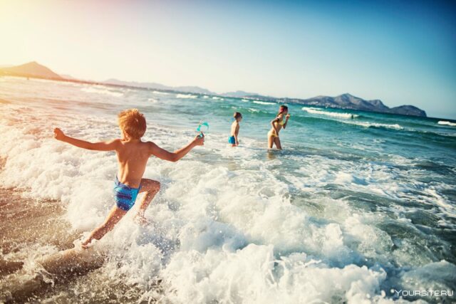 Teaching kids water safety - child swimming in a pool