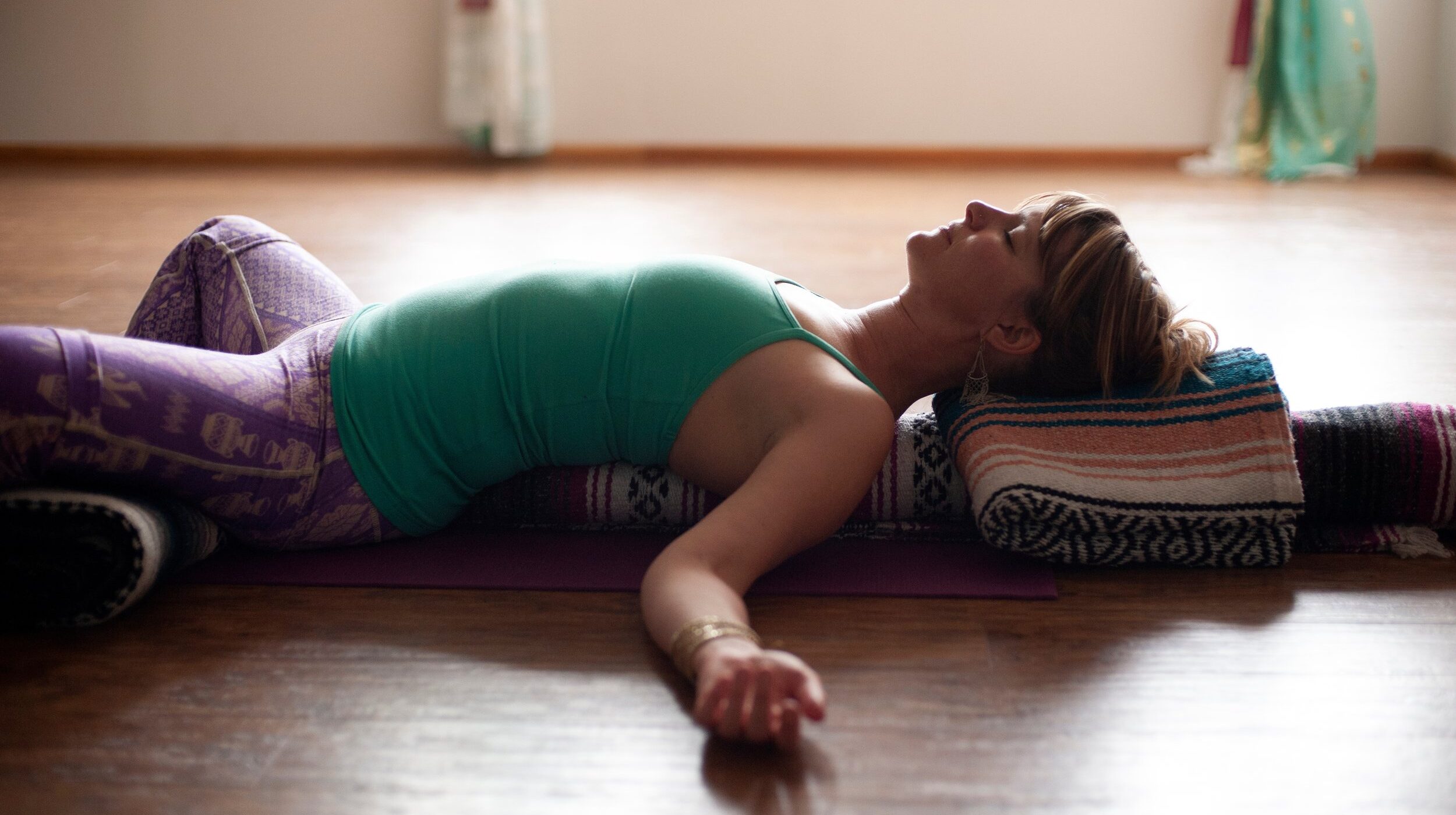 Yoga postures demonstrated by a strong gentle, yoga teacher in h